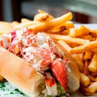 Lobster Roll · Fresh lobster, tomato, celery, lettuce, and our special roll dressing are served with your c...