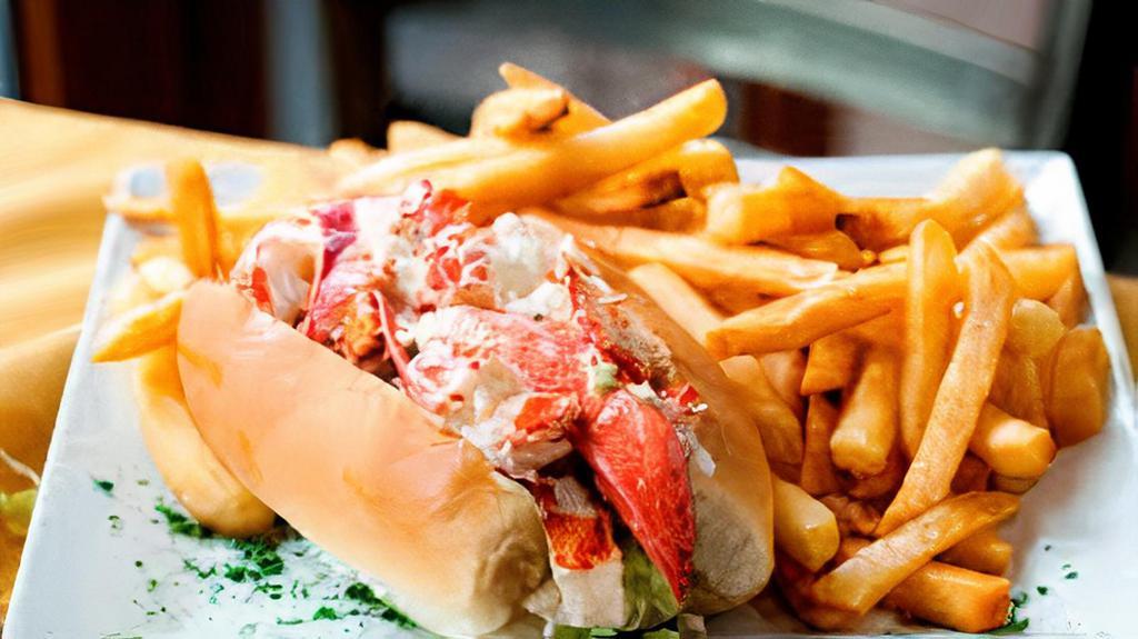 Lobster Roll · Fresh lobster, tomato, celery, lettuce, and our special roll dressing are served with your choice of fries.