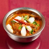 Lamb Vindaloo · Original goat curry of onions, tomatoes, potatoes and spices.