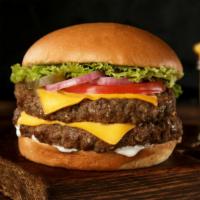 Double Cheeseburger · Delicious juicy beef patty with double cheese and house toppings on a buttery bun.