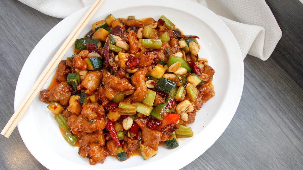 Kung Pao Chicken · Diced dark meat chicken wok-tossed with carrots, celery and peanuts in spicy brown sauce