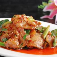 Twice Coked Pork 回锅肉 · Sliced tender pork belly stir-fried with cabbage and red and green peppers in a spicy bean s...