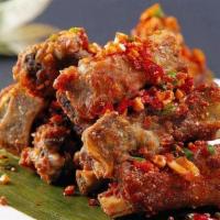 Salted & Pepper Pork Ribs 椒盐排骨 · Crispy bone-in pork ribs in aromatic spices topped with roasted salt and chili pepper