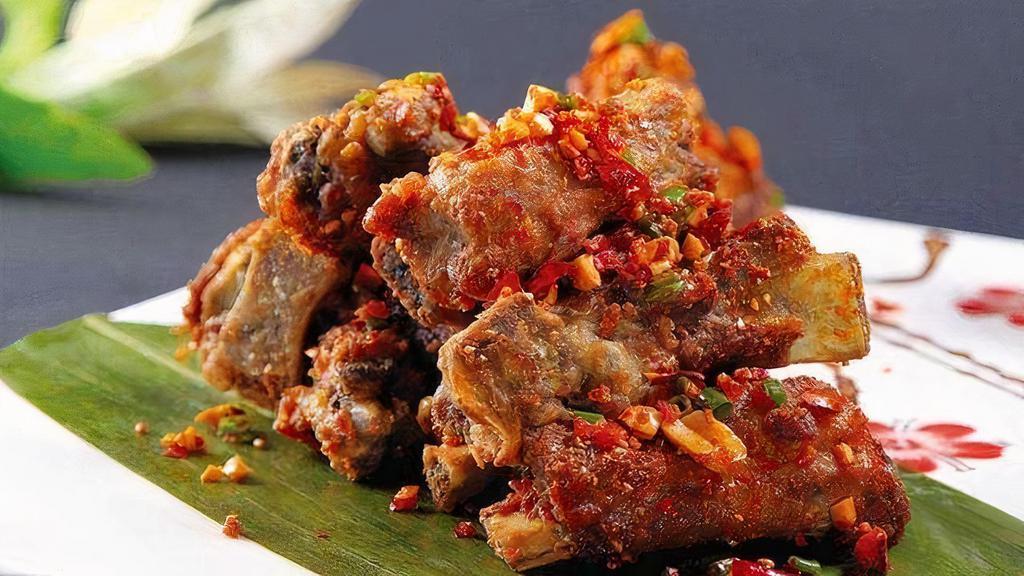 Salted & Pepper Pork Ribs 椒盐排骨 · Crispy bone-in pork ribs in aromatic spices topped with roasted salt and chili pepper