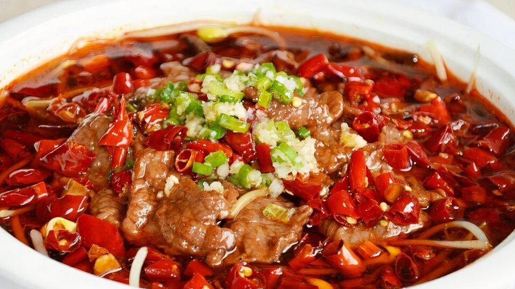 Boiled Beef In Spicy Chili Sauce 水煮牛肉 · Thinly sliced beef with Chinese cabbage, celery and bean sprouts cooked in chef's special soup
