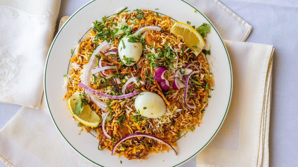 Chicken Dum Biryani · Chicken (with bone) cooked with basmati rice and spices.