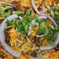 Goat Dum With Bone Biryani · Tender pieces of goat cooked in basmati rice and spices.