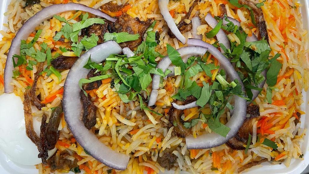 Goat Dum With Bone Biryani · Tender pieces of goat cooked in basmati rice and spices.