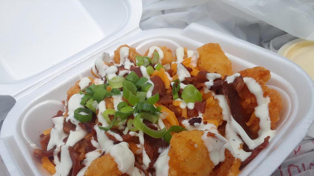Loaded Tots · queso, bacon, ranch, scallion, rib rub.  add chili for an additional charge.
