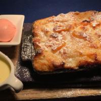 White Chocolate & Apricot Croissant Bread Pudding · Creme Anglaise, Strawberry Gelato.