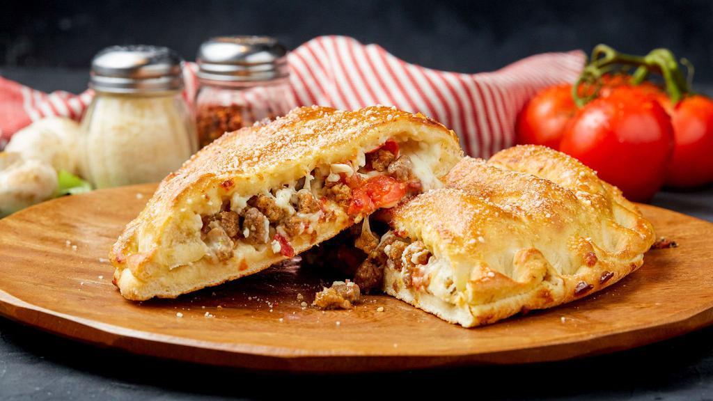 6 Meat Calzone · Italian Sausage, Beef, Bacon, Pepperoni, Canadian Bacon, and Sausage.