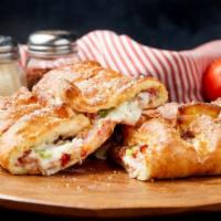 The Great Stromboli · Canadian Bacon, Bacon, Onions, and Green Peppers with Mozzarella Cheese and our signature Ra...