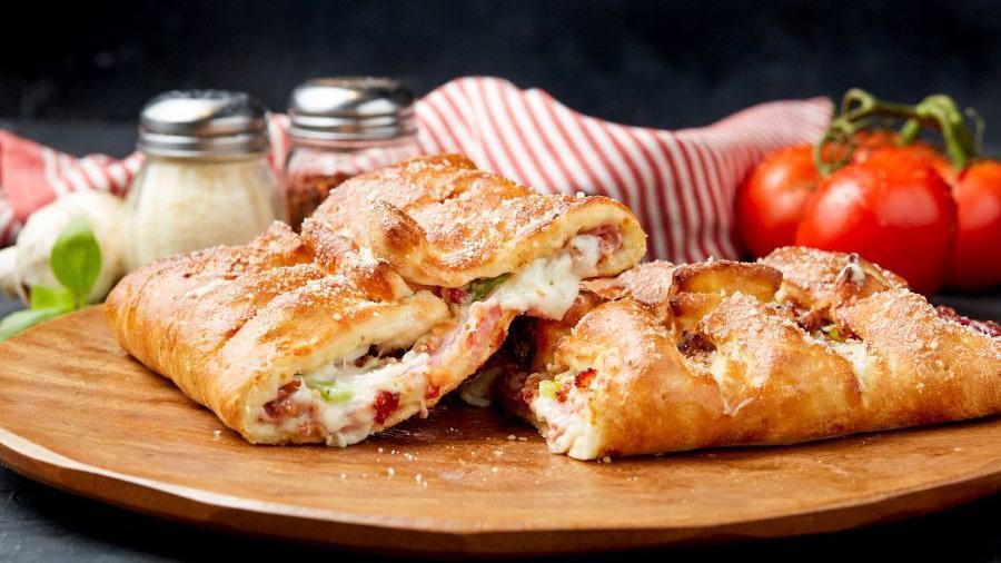 The Great Stromboli · Canadian Bacon, Bacon, Onions, and Green Peppers with Mozzarella Cheese and our signature Ranch Dressing