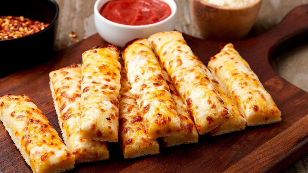 Garlic Breadsticks · A blend of cheeses melted over our delicious dough and brushed with garlic butter sauce