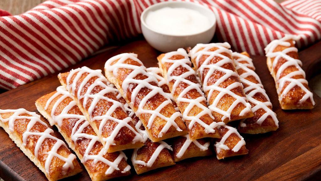 Cinnamon Breadsticks · Breadsticks sprinkled with cinnamon and sugar and drizzled with sweet icing.
