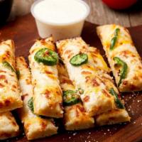 Jalapeño Breadsticks · A blend of cheeses melted over our delicious dough and brushed with garlic butter sauce.