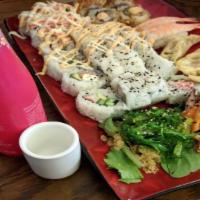 Tsp Sampler Platter · 24-pieces of sushi, shrimp nigiri, three miso soups, three gyozas, ika, and wakame salad.