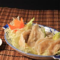 Ap14. Siam Square Dumpling (6) · Steam pot stickers stuffed with finely chopped vegetable and chicken. Served with house spec...