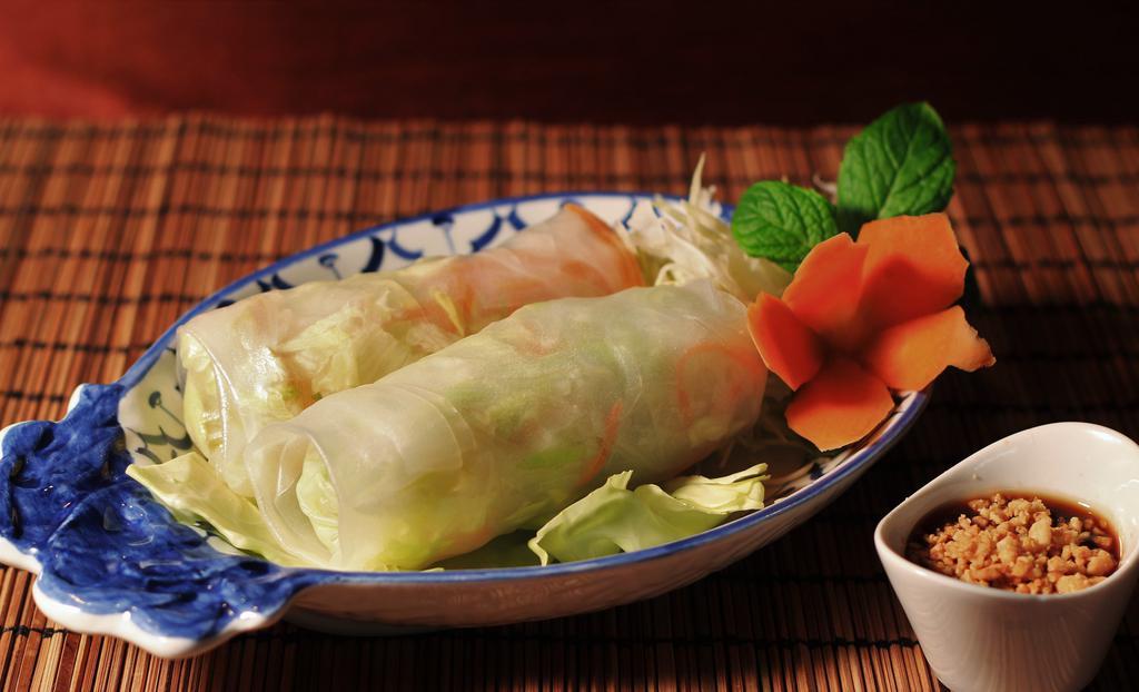 Thai Fresh Spring Rolls (2) · Fresh lettuce, carrots, beansprouts, cilantro, cucumber, and tofu wrapped with rice paper served with plum sauce and ground peanut.