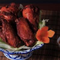 Ap11. Thai Buffalo Wings (6) · Chicken wings marinated with Thai seasoning, deep fried until golden brown and served with s...