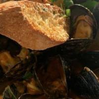 Steamed Mussels · White or red wine sauce, garlic crostini.
