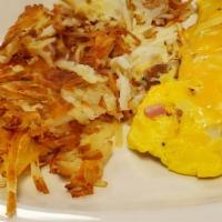 Meat Lovers Omelet · Filled with bacon, ham, and sausage while topped with melted cheese. Served with hash browns...