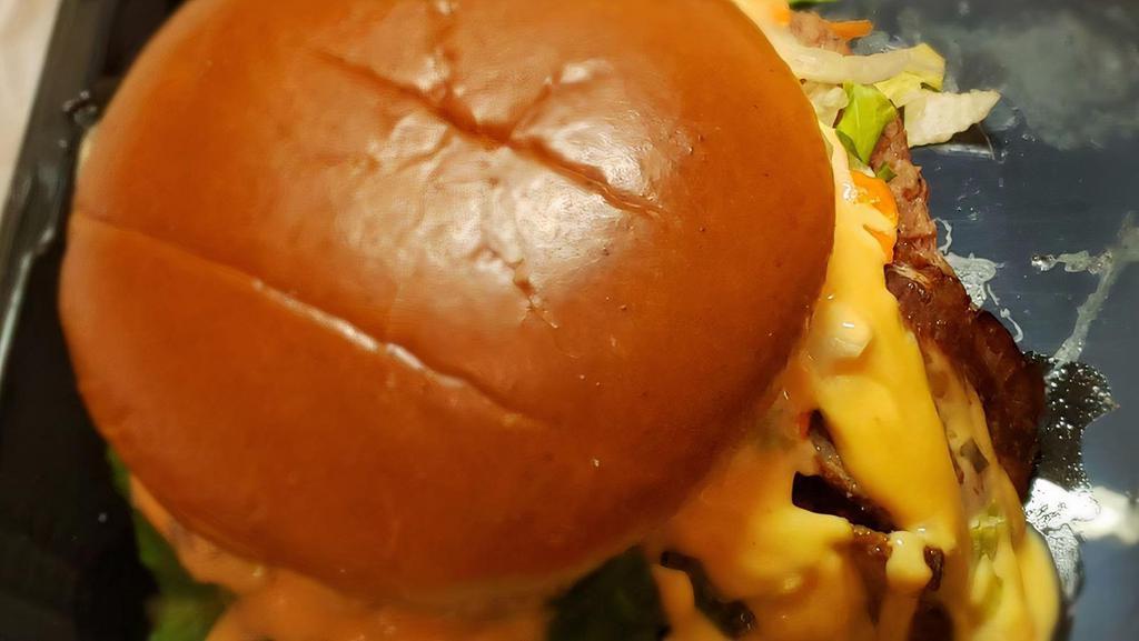 Chicago Burger · 1/3 pound grilled angus beef patty with grilled tomato, onion, lettuce, and bacon topped with cheese and thousand island dressing.