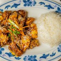 Sesame Chicken · Breaded white meat chicken, stir fried in a spicy sweet tangy sauce with sauteed onions, top...