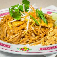 Pad Thai · Rice noodles stir-fried with bean sprouts, green onions, toppe with cilantro, limes, and cru...
