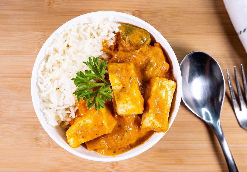 Tofu Masala · Fresh cubed tofu cooked in a house special masala with sliced onions, tomatoes, ginger, and bell peppers.