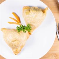 Vegetable Samosas · Warm crispy stuffed pastries of potatoes and green peas blended with Indian spices. Perhaps ...
