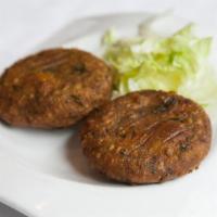 Alu Tikki · Boiled potato cutlets mashed with freshly ground spices and fried in chickpea batter.