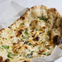 Naan · Leavened flat bread made from white flour baked in our tandoor, south Asia’s most popular br...