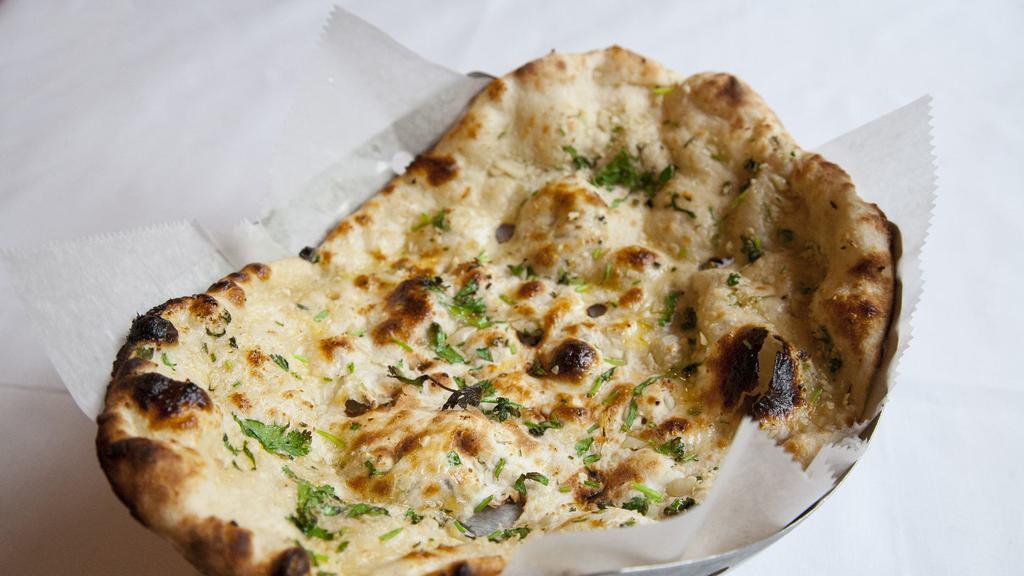 Naan · Leavened flat bread made from white flour baked in our tandoor, south Asia’s most popular bread.