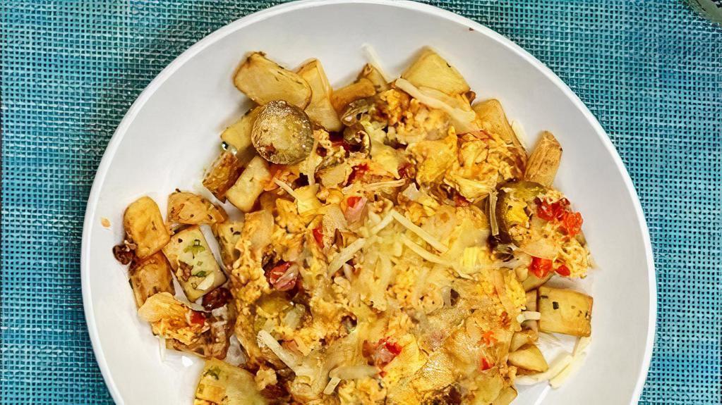 Chorizo Scramble · chorizo , scrambled eggs, onions, jalapenos, red pepper, pepperjack cheese, on top of crispy breakfast potatoes