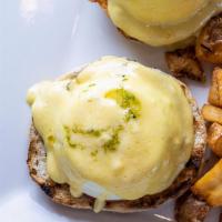 Brunch Benedict · Poached eggs, Canadian bacon, English muffin, hollandaise, chive oil, chives