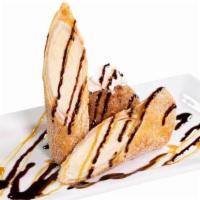 Xango · A crispy flour tortilla filled with creamy cheesecake, then deep-fried and dusted with cinna...
