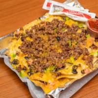 Nacho Supreme · Chicken or beef, green peppers, onions, tomatoes, black olives and cheddar.