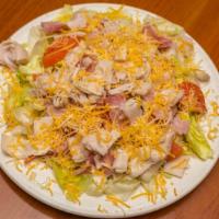Chef Salad · An old time favorite served with ham, turkey, cheddar and Monterey jack cheeses and tomatoes.