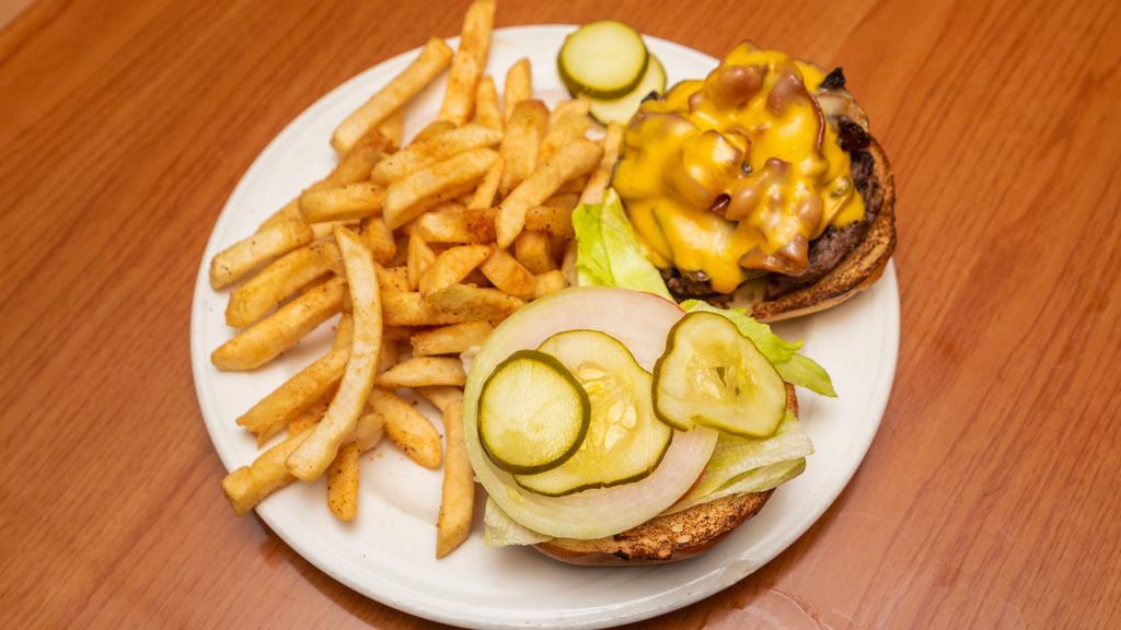The Works Burger · Half pound burger with grilled bacon, onions and mushrooms topped with Swiss and American cheese.