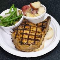 Pork Chop · Bone-in 14 - 16 oz. chop served over Vienna bread. NO SIDE