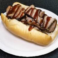 Brisket Sandwich · Smoked beef brisket served on a six-inch roll topped with BBQ sauce. NO SIDE