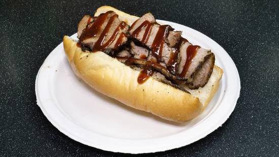 Brisket Sandwich · Smoked beef brisket served on a six-inch roll topped with BBQ sauce. NO SIDE