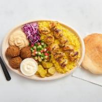 Chicken Breast Kebab Plate · 2 chicken breast kebabs, basmati rice, 3 falafel, hummus, garlic sauce, chopped salad, purpl...