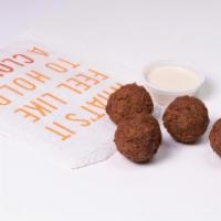 Falafel 4-Pack · 4 house-made falafel with a side of tahini. Vegan and gluten free.