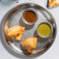 Samosa & Delilah (Chicken) · Two pieces of chicken thigh meat cooked in authentic Indian spices, wrapped in warm flour to...