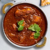 Chicken Vindaloo · Traditionally cooked boneless chicken thigh with potatoes, our special housemade curry masal...