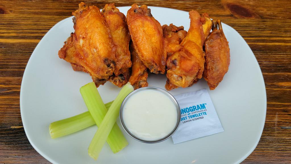 Jumbo Wings · Marinated 24 hours, flash fried to order, available flavors; guinness BBQ, buffalo or dry jerk rub.
