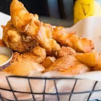 Harp Battered Chicken Tenders · With chips and honey mustard.