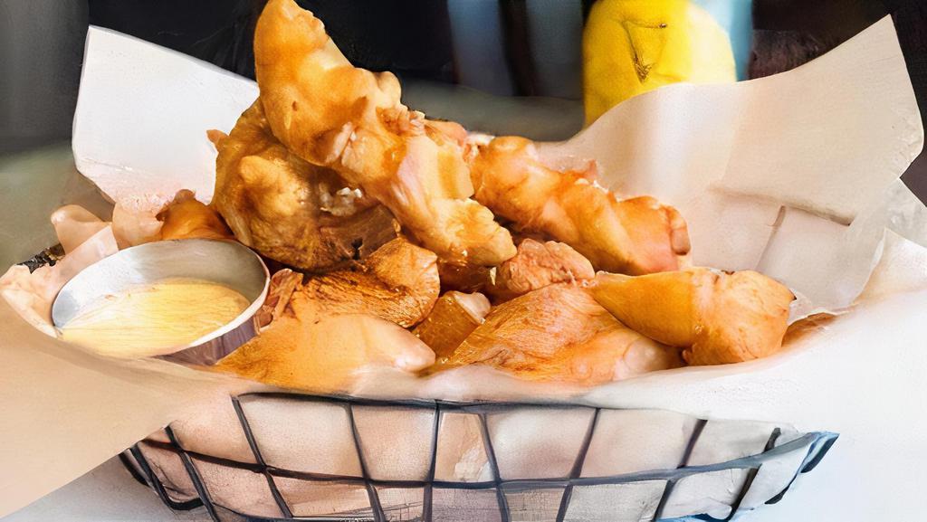 Harp Battered Chicken Tenders · With chips and honey mustard.